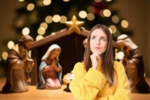 presepe sullo sfondo e donna che pensa