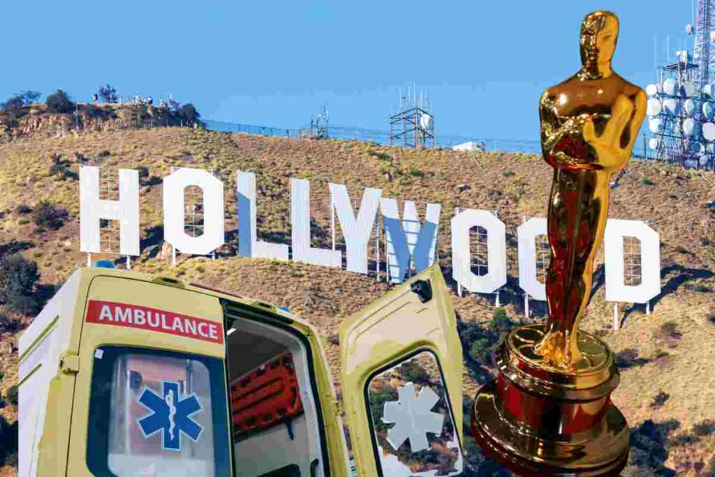 La scritta Hollywood con una ambulanza e la statuetta del premio Oscar
